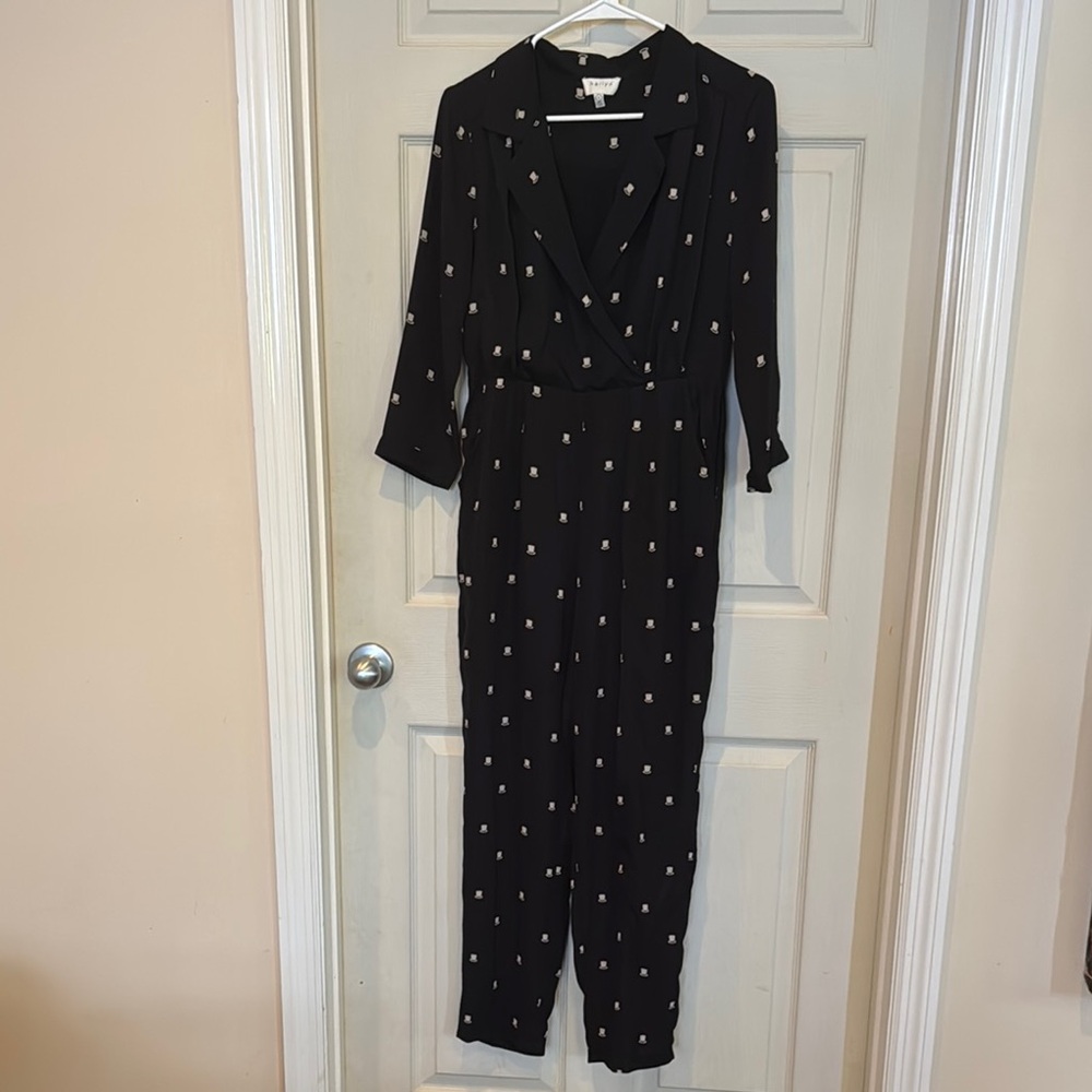 Elegant Black Jumpsuit with White Top Hat Accents from Anthropologie